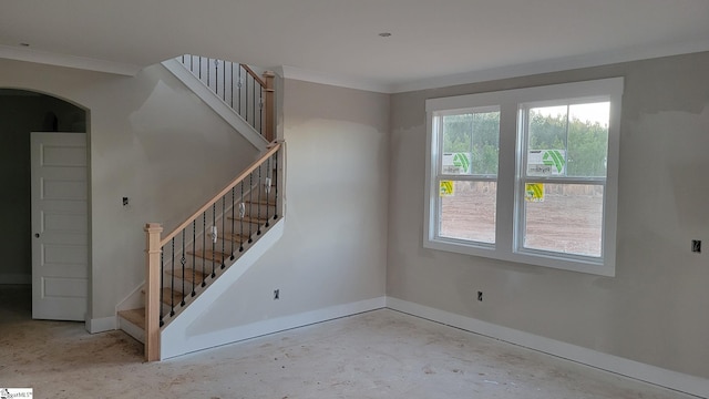 unfurnished room with ornamental molding