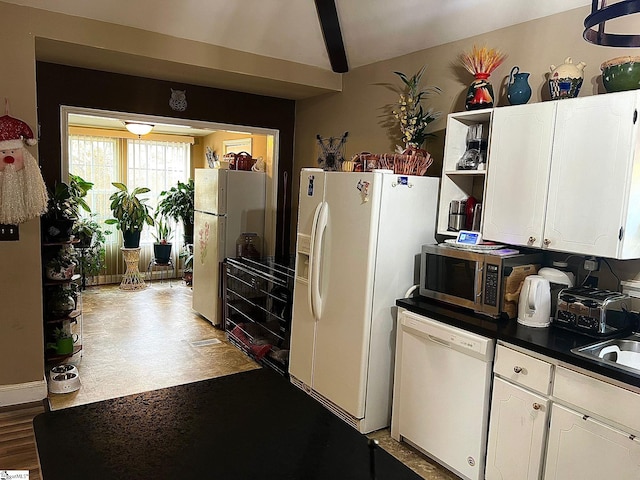 kitchen with white cabinets, white appliances, hardwood / wood-style flooring, and sink