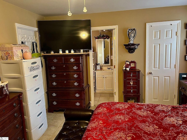 tiled bedroom featuring ensuite bathroom