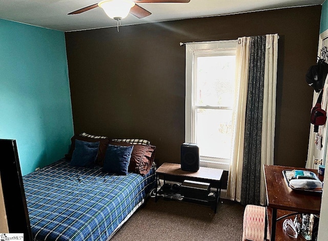 carpeted bedroom with ceiling fan