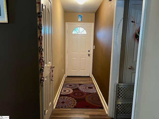 doorway with dark hardwood / wood-style flooring