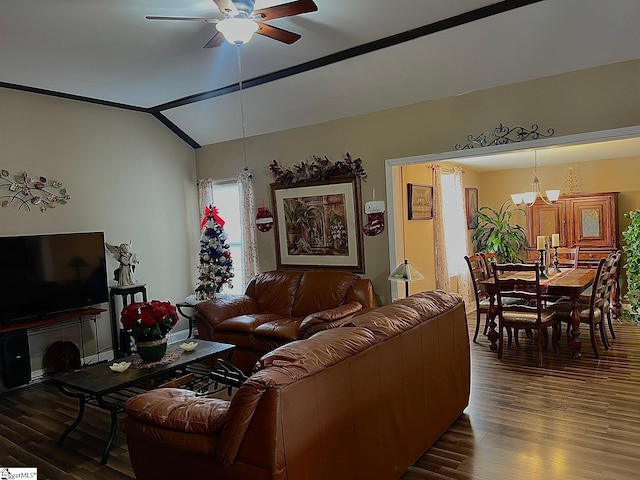 living room with ceiling fan with notable chandelier, dark hardwood / wood-style flooring, and lofted ceiling