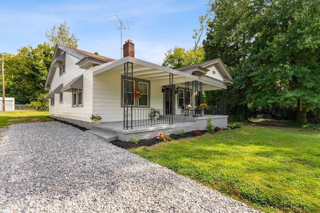 view of front of house featuring a front lawn and a porch