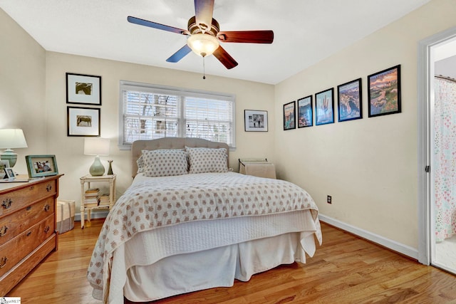 bedroom with light hardwood / wood-style flooring and ceiling fan