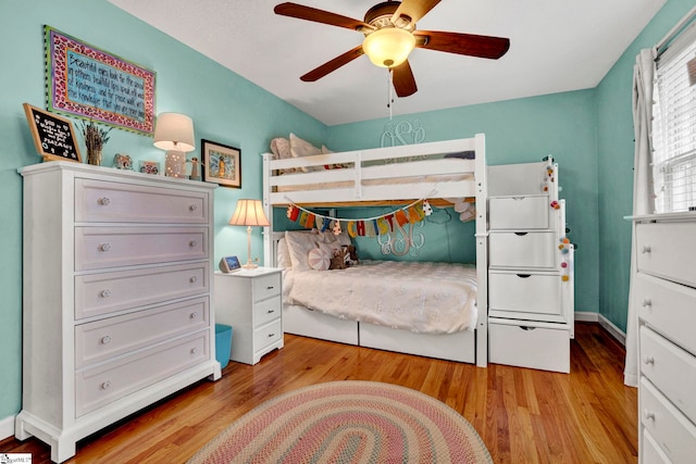 bedroom with ceiling fan and light hardwood / wood-style flooring