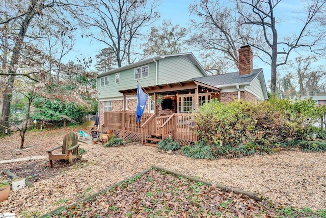 rear view of house with a wooden deck