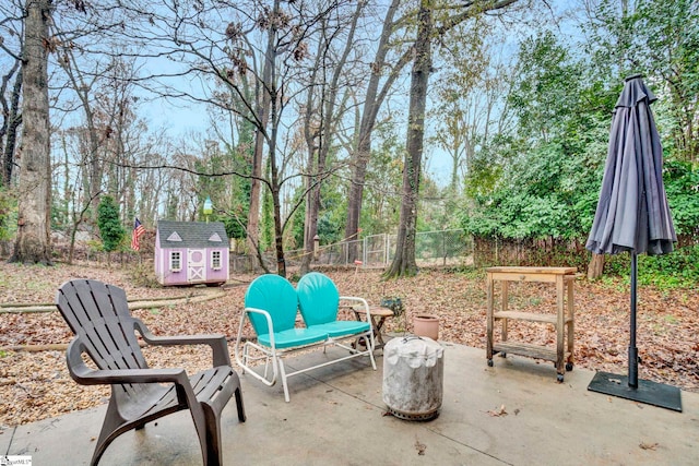 view of patio / terrace featuring a shed