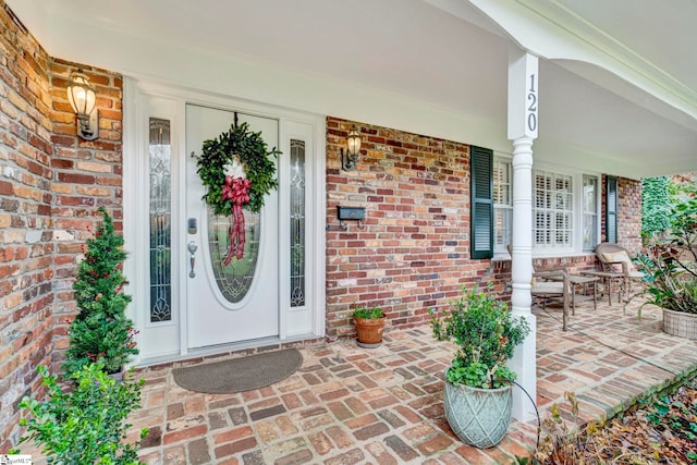 doorway to property with covered porch