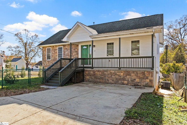 view of front of house featuring covered porch and central AC unit