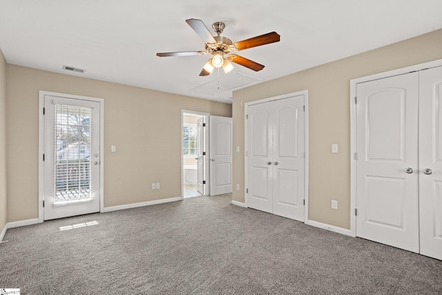 unfurnished bedroom with carpet flooring, multiple closets, ceiling fan, and access to outside