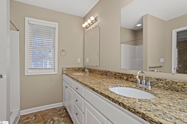 bathroom featuring vanity and a shower