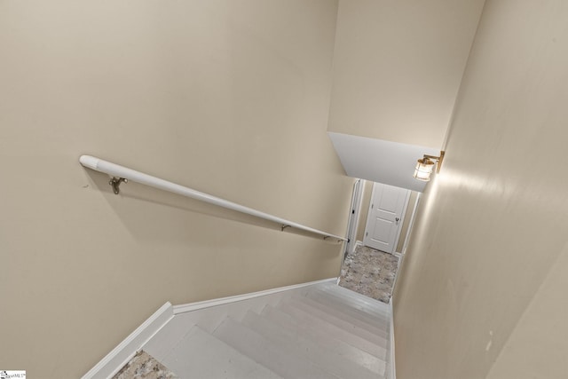 stairs featuring wood-type flooring