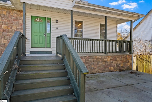 entrance to property featuring a porch