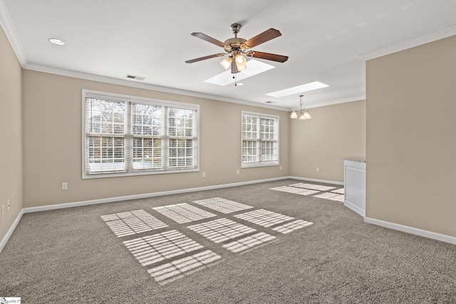 carpeted empty room with crown molding and ceiling fan with notable chandelier