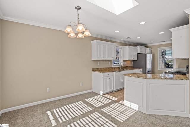 kitchen featuring light carpet, sink, white cabinets, and appliances with stainless steel finishes