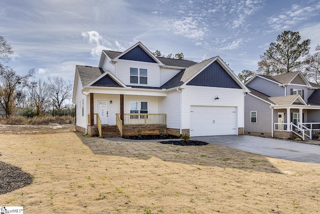 craftsman house with a garage, covered porch, and a front lawn