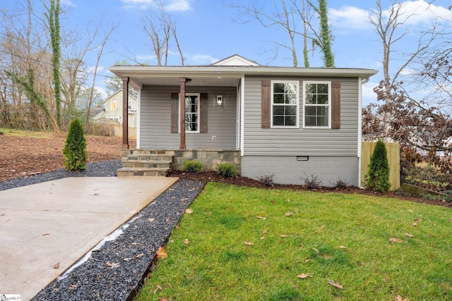 bungalow-style house featuring a front yard