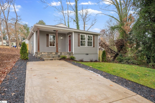 bungalow-style house with a front lawn