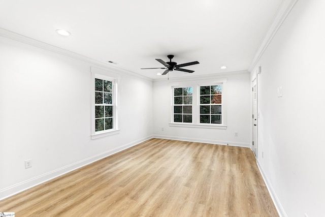 empty room featuring ornamental molding, light hardwood / wood-style floors, and ceiling fan