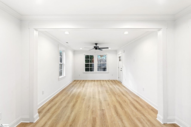 spare room with crown molding, light hardwood / wood-style flooring, and ceiling fan