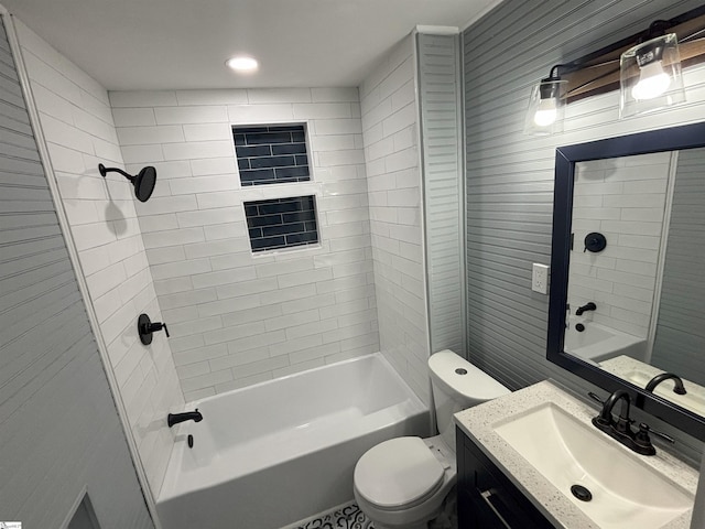 full bathroom with tiled shower / bath combo, toilet, and vanity