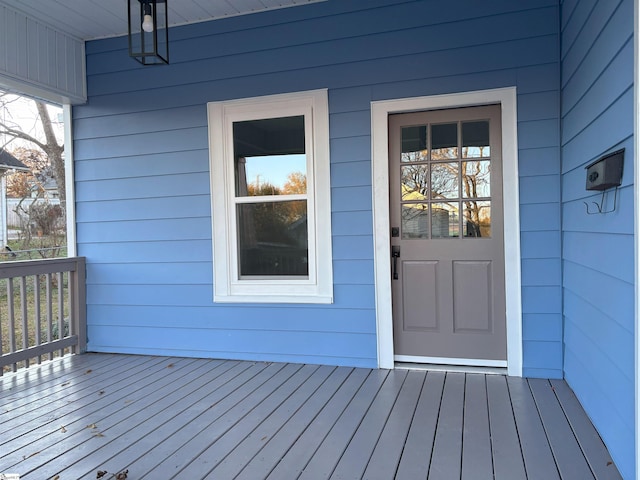 property entrance featuring a wooden deck