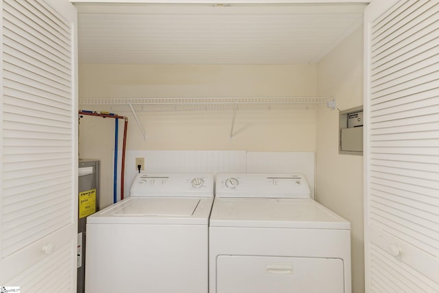 laundry area with washing machine and dryer and electric water heater