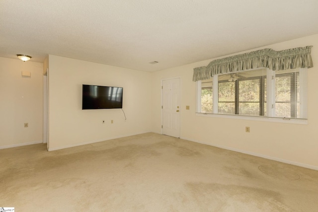 empty room featuring carpet floors