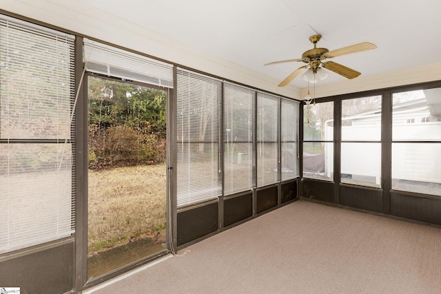 unfurnished sunroom with ceiling fan and a healthy amount of sunlight