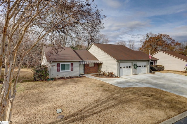 ranch-style home with a front yard and a garage