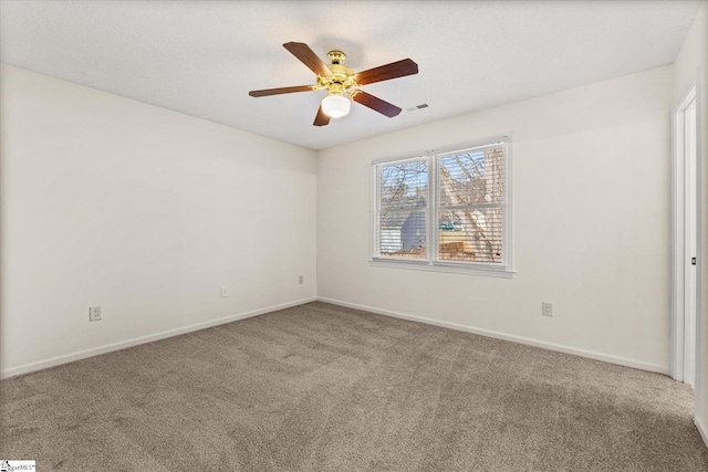 unfurnished bedroom featuring visible vents, a ceiling fan, a textured ceiling, carpet, and baseboards