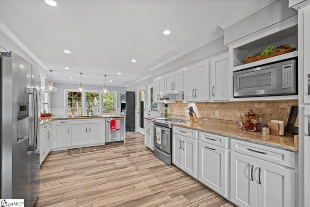 kitchen featuring appliances with stainless steel finishes, crown molding, decorative light fixtures, light hardwood / wood-style flooring, and white cabinetry