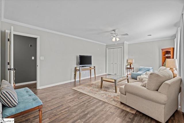 living room featuring ceiling fan, crown molding, and dark wood-type flooring