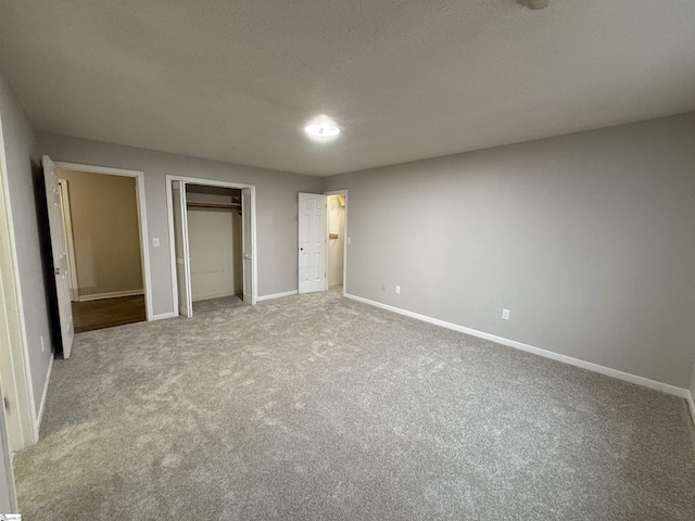 unfurnished bedroom with baseboards and carpet floors