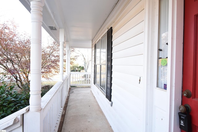 balcony featuring visible vents and a porch