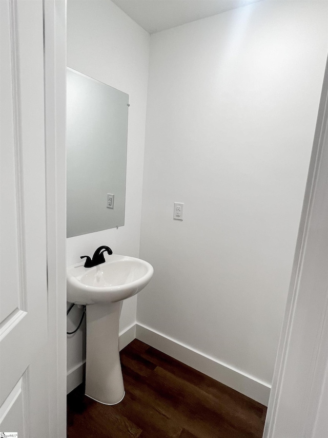 bathroom with wood-type flooring