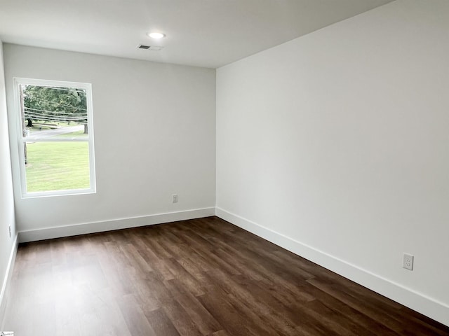 empty room with dark hardwood / wood-style floors