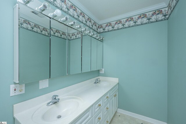 bathroom featuring vanity, a textured ceiling, and ornamental molding