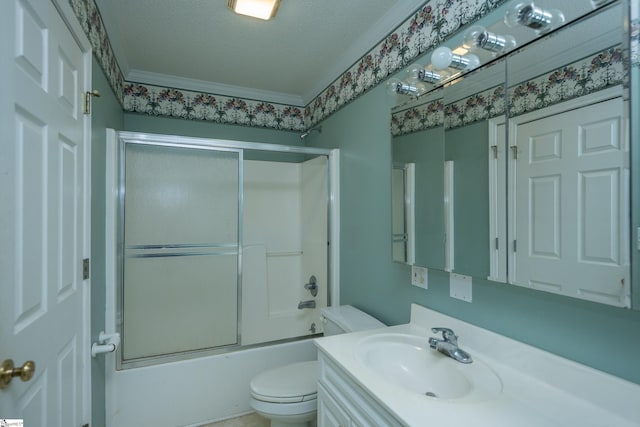 full bathroom with vanity, bath / shower combo with glass door, toilet, ornamental molding, and a textured ceiling