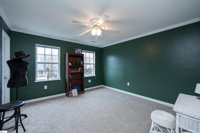 office space featuring ceiling fan, crown molding, carpet, and a textured ceiling