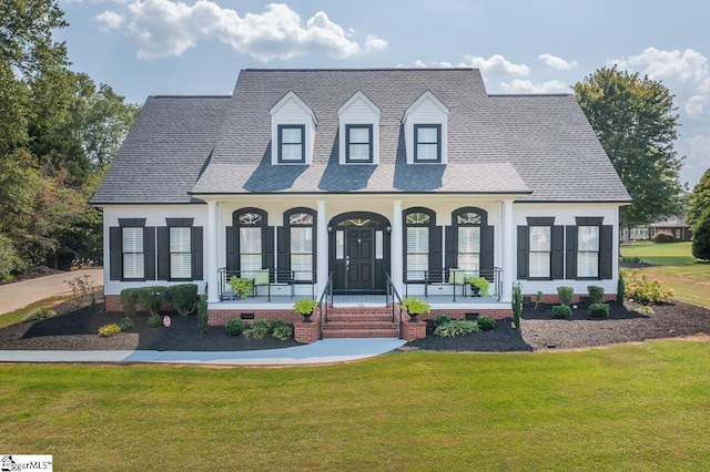 view of front of home featuring a front lawn and a porch