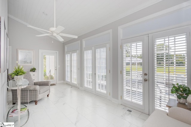 sunroom with ceiling fan, french doors, and vaulted ceiling