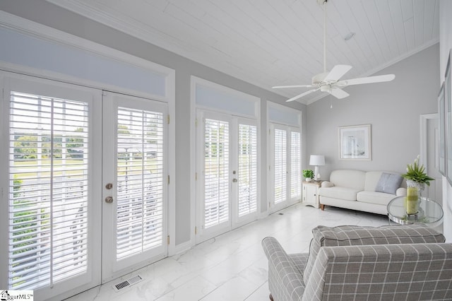 sunroom with french doors, vaulted ceiling, and ceiling fan