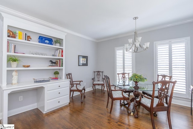 dining area featuring dark hardwood / wood-style flooring, ornamental molding, and an inviting chandelier