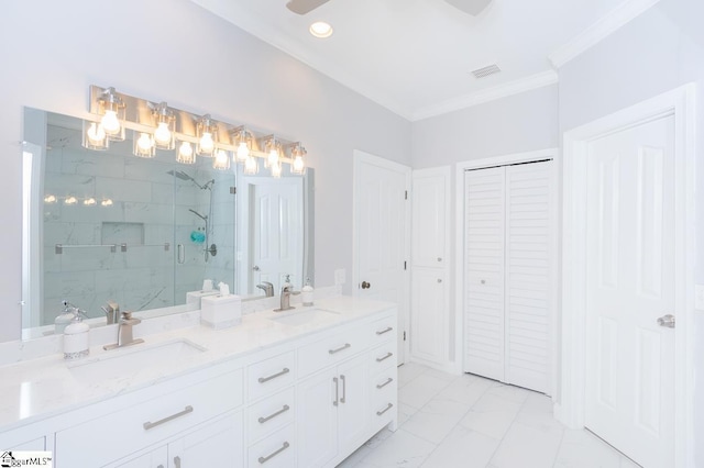 bathroom with vanity, crown molding, and a shower with shower door