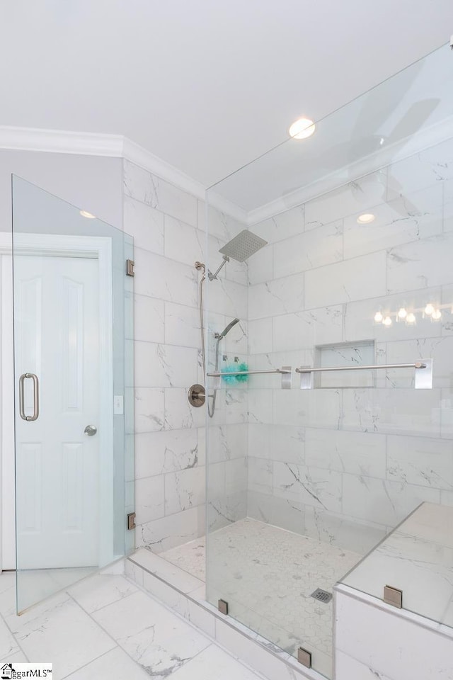 bathroom featuring crown molding and walk in shower