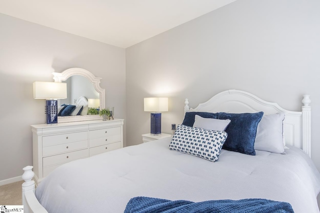 carpeted bedroom with vaulted ceiling