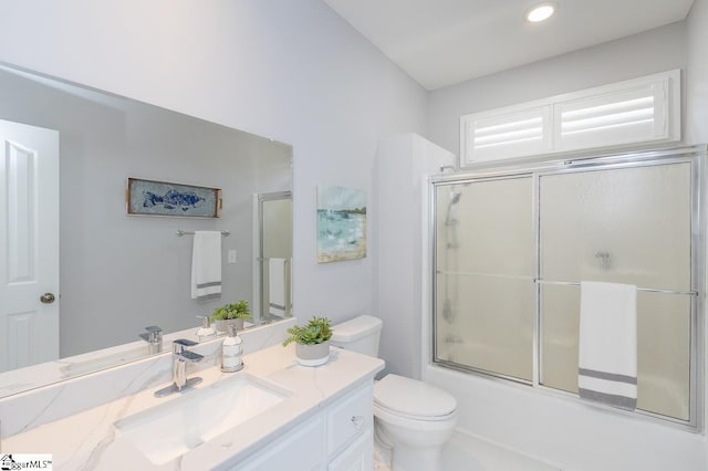 full bathroom featuring tile patterned flooring, vanity, toilet, and enclosed tub / shower combo