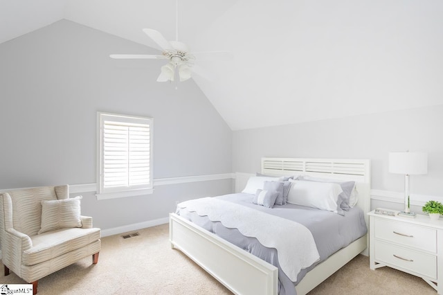 bedroom featuring ceiling fan, light colored carpet, and vaulted ceiling