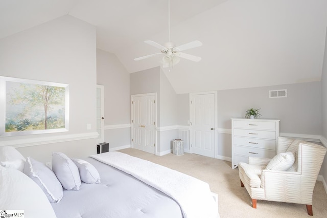 carpeted bedroom with ceiling fan and lofted ceiling